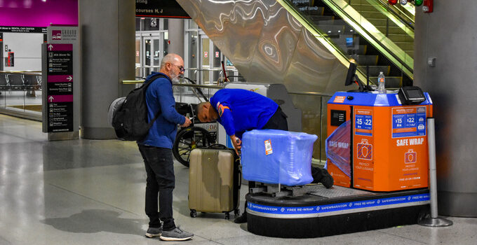 Miami International Airport luggage wrapping station